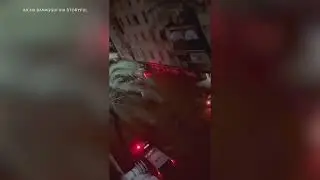 Man Breaks Glass Door to Rescue Children From Floodwaters in Paiporta
