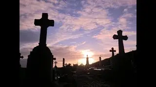 Paying a visit at the cemetery on All Soul's Day to offer prayers, flowers and candles