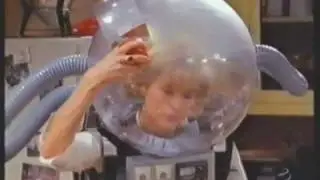 Actress Tea Leoni Wearing Bubble Helmet.