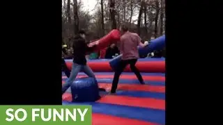 College kids engage in inflatable jousting battle
