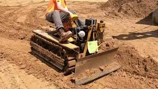 Agricat Mini Dozer Pushing Dirt At National Pike Steam Show