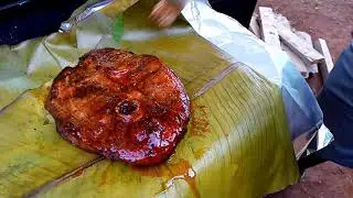 Grilled pork wrapped in smoked Banana leaf.(Luwombo)