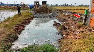 Building New Road Stone to connect Wall by power dozer d31 with dump truck