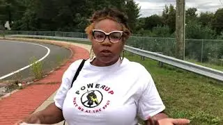 PowerUp CT's Keren Prescott speaks outside East Catholic High School on 9/29