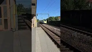 Helenelund station with passing Arlanda express train
