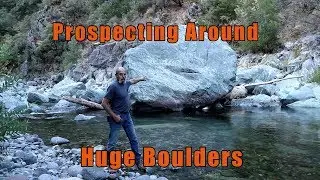 Prospecting around a huge boulder