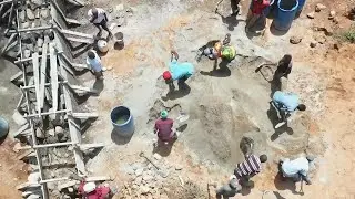 To make water last year-round, Kenyans in dry regions are building sand dams on seasonal rivers