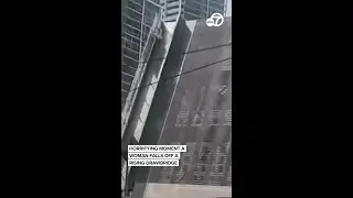 Horrifying moment a woman falls off a rising drawbridge