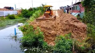 Amazing job and excellent BULLDOZER build the new road cross the lake with dump truck