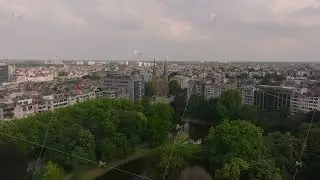 Aerial view of the urban landscape of Antwerp, Belgium, slowly panning from left to right, showing
