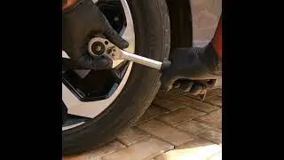 Turn crankshaft bolt through the wheel