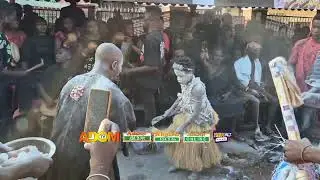 A traditional display by a fetish priest marks a powerful moment of spiritual homage....