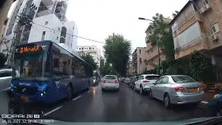 Fragments of a drive in Bnei Brak after raining: water, children, adults, religious Jews 