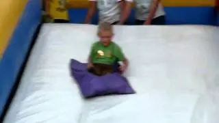 Cole on the bouncy slide