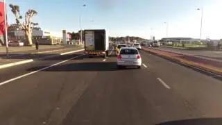 Gourmet Foods truck (CA 756-421) runs solid line to jump queue