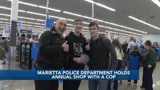 Marietta Police Department hosts shop with a cop at local Walmart