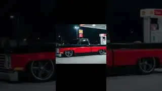 1983 Chevy black/red C10 square body bagged on 22s
