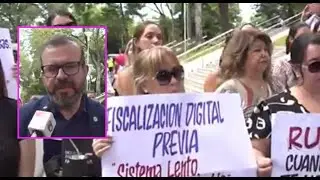 Escribanos se manifiestan contra el RUN frente al Palacio de Justicia