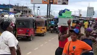 Vibrant Chaos: Exploring Monrovia's Crowded Market in Liberia 2025