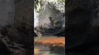 Mesmerizing water reflection on rock cave.