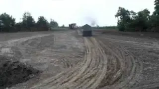 M51A2 Army dump truck hauling shale