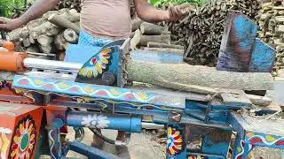 হাইড্রোলিক মেশিন দ্বারা জ্বালানি কাঠ চেরাই