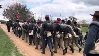 Confederate troops marching to their surrender at Appomattox