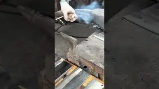Blacksmith Using Hammer To Forge Hot Metal On Anvil