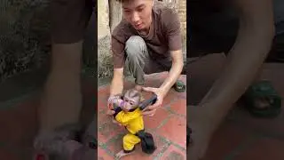 Dad helps Subi drink milk