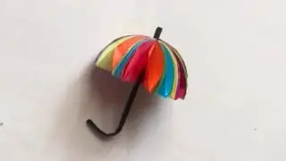 simple craft results in a colorful🪅, decorative paper umbrella, perfect for kids 