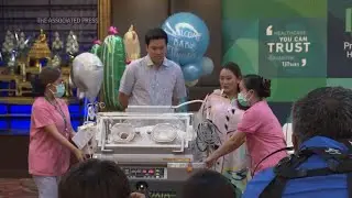 Thai PM candidate unveils newborn son
