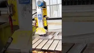 Precision Stone Cutting: Automated Machine Slicing Granite Slabs for Flooring.