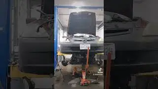 engine and transmission on jacks w/subframe