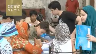 Sibling pair start 'street class' for child beggars in Pakistan