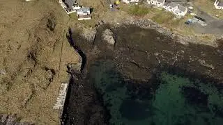 Drone footage of Castlebay with Gaelic narration