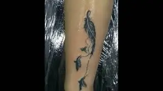 Feather tattoo by chalisa tattoo