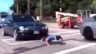 Doing push ups while cars run over him