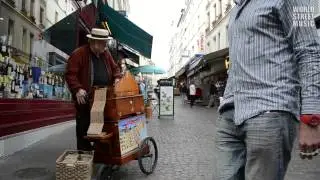 Organ Grinder Busker on the street in Paris