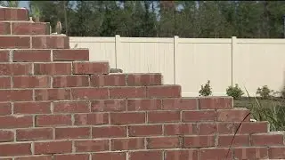 Video: Fed-up neighbors fix wall still broken from Hurricane Irma
