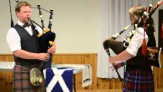 Clan Chief Ruairidh MacLennan pipes with Bayley MacDonald at Clan Dinner