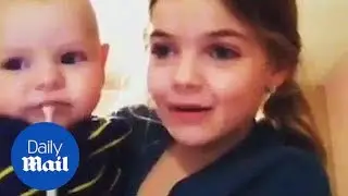 'Say hi!' Little brother throws up as sister introduces him - Daily Mail
