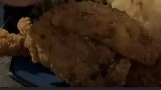 Making some fried fish with some chitlins