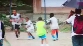 Brazilian children playing football
