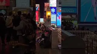 Jamming with Glico Man at Dotonbori