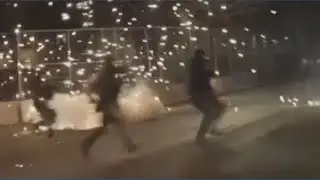 Federal agents toss flashbangs toward protestors outside federal building in Minneapolis