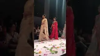 Beautiful models in exquisite designer sarees doing rampwalk at a fashion show