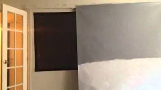 Black projector screen compared to high contrast gray screen