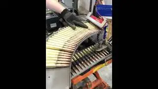 machine gun bullets belt loading##action#=reaction