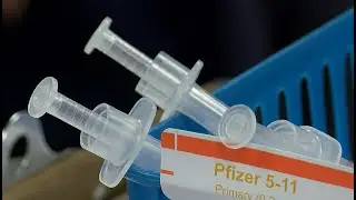 Who makes decision for child COVID-19 vaccination if parents divorced?