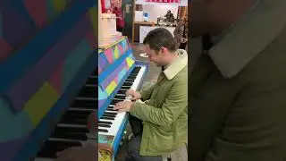 Frodo Baggins, Elijah Wood playing the Star Wars theme on piano at The Fremantle Markets, Australia
